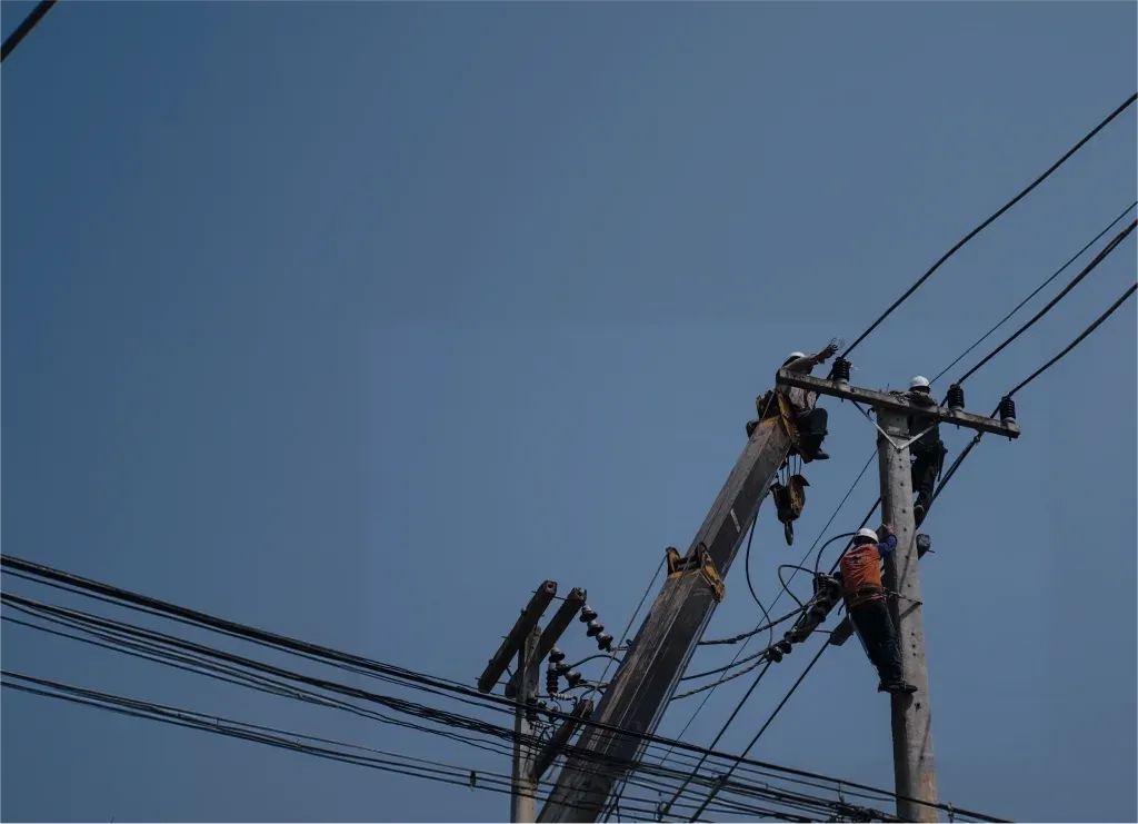 Meralco line crews work together on the electricity network.