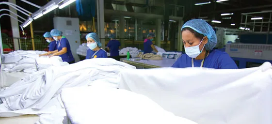 Workers sort products at the Marby factory.