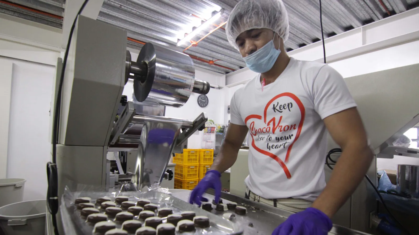 Worker prepares Chocovron products at the factory.