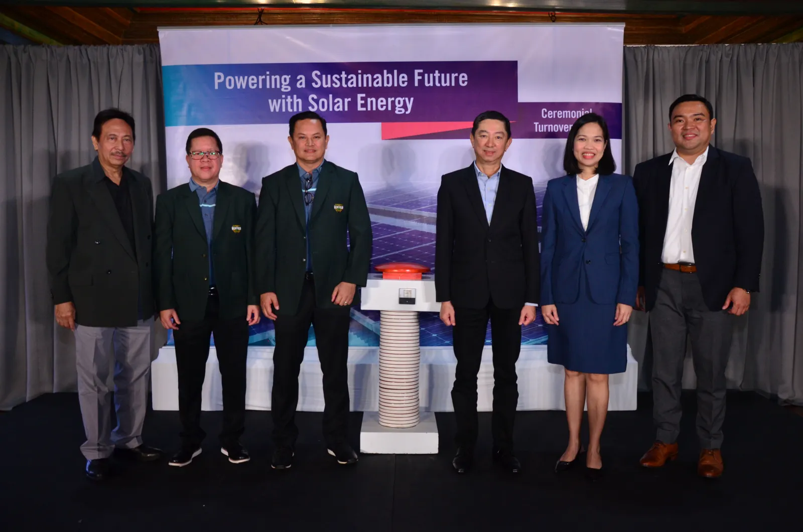 Orchard and Meralco representatives at a signing ceremony.
