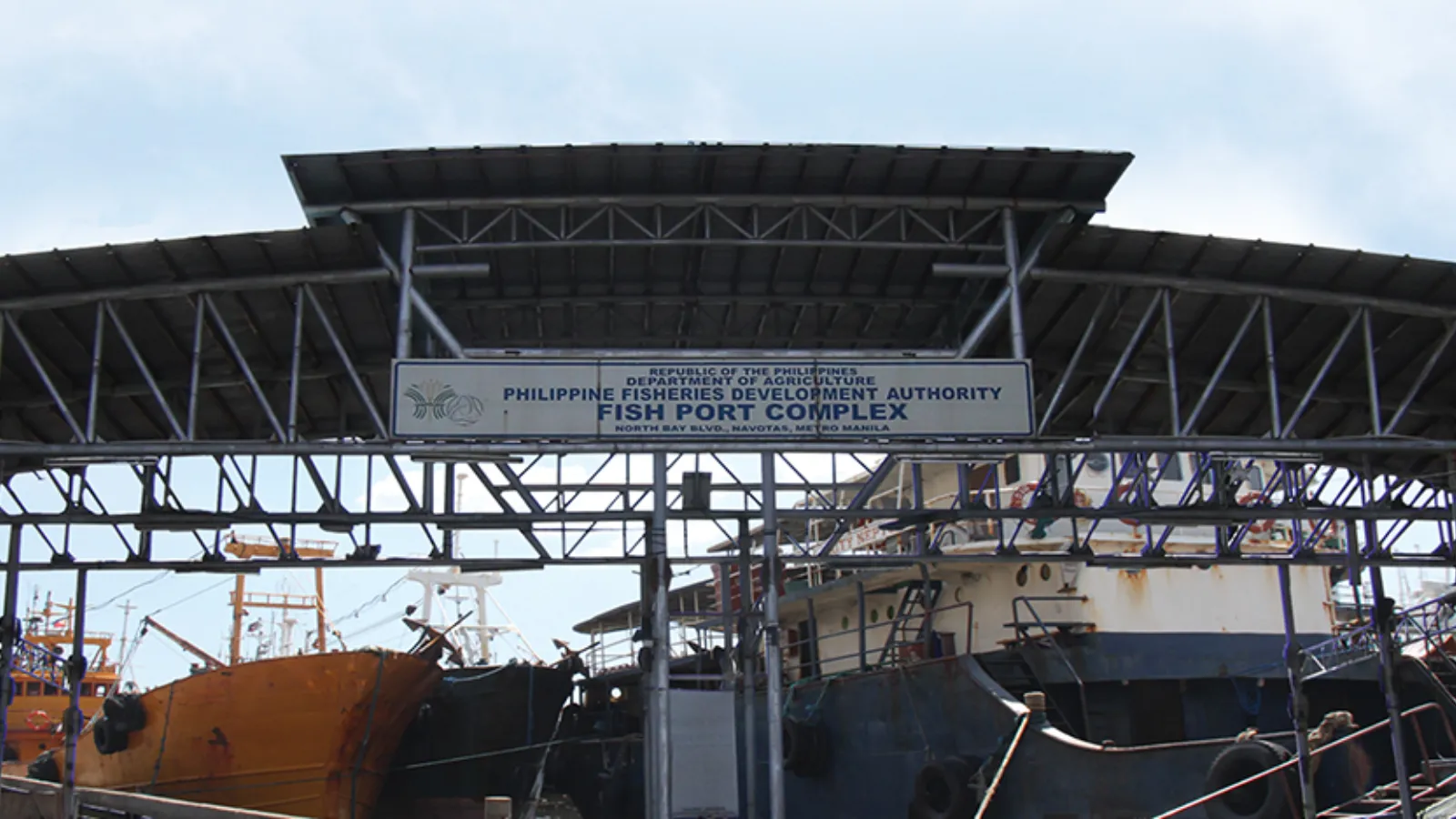 Fishing industry representatives beside a Navotas facility.