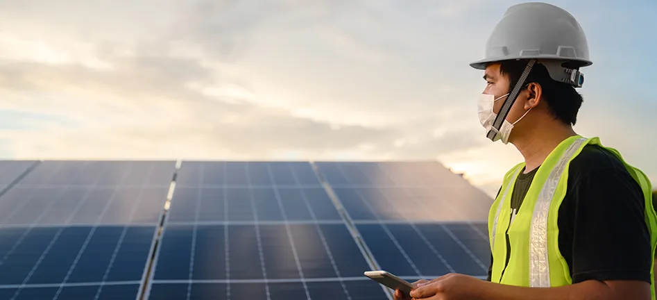 Engineer inspecting a rooftop solar installation