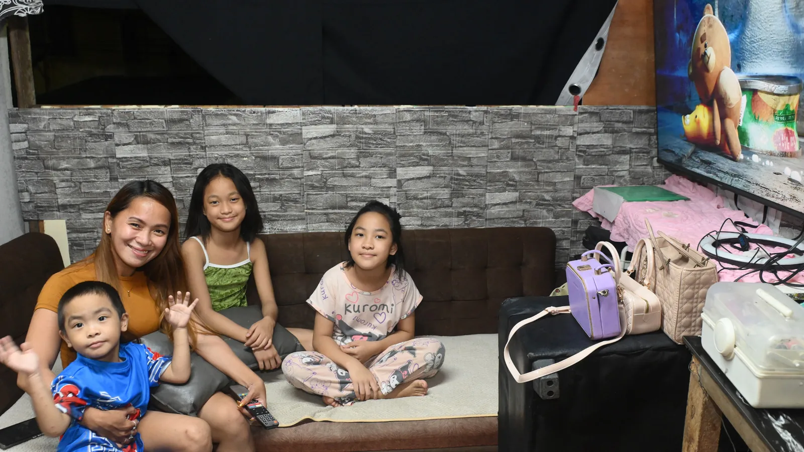 Maan Cruz-Atienza with her family in their Novaliches home.