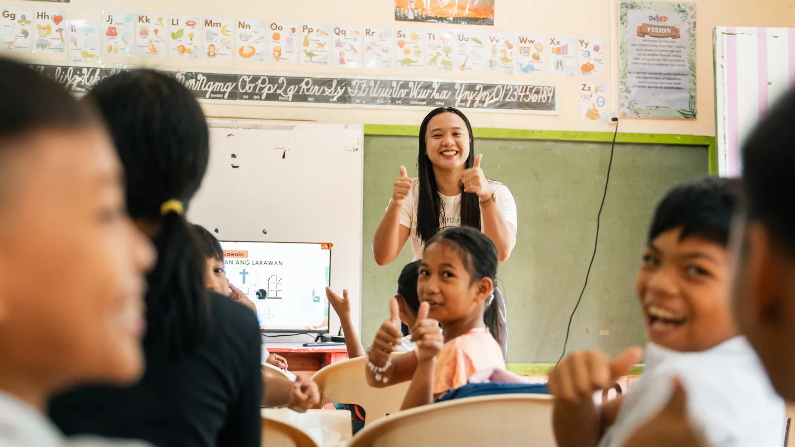 A teacher leading an interactive lesson with students at Cagbalete II Elementary School.