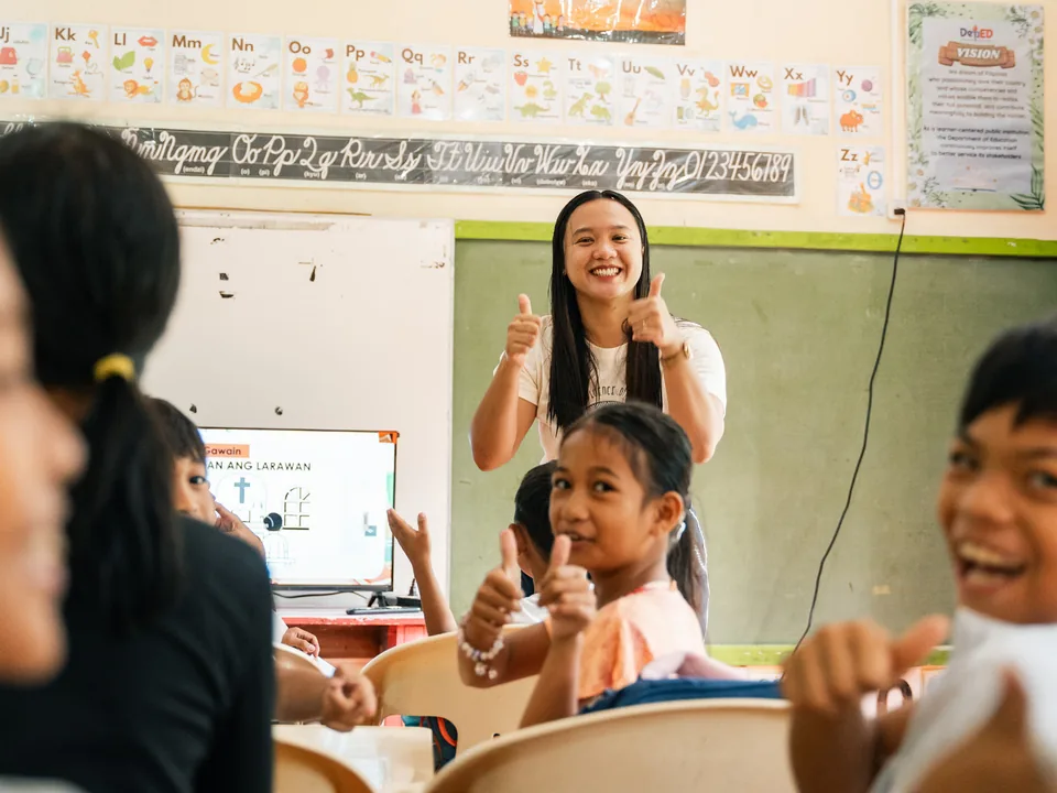 A teacher leading an interactive lesson with students at Cagbalete II Elementary School.