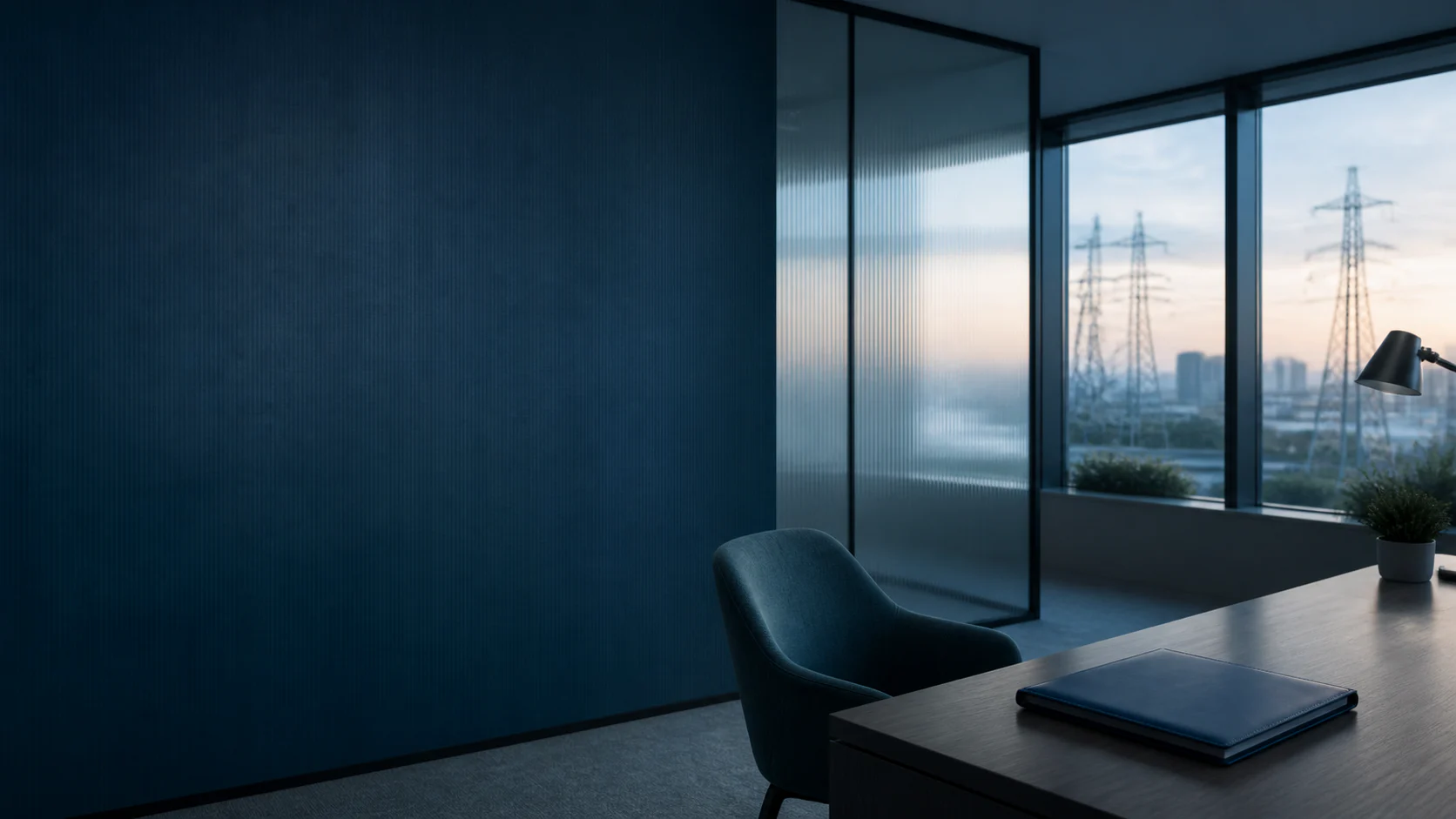 A private consultation room overlooking a city and electrical transmission lines at dawn.