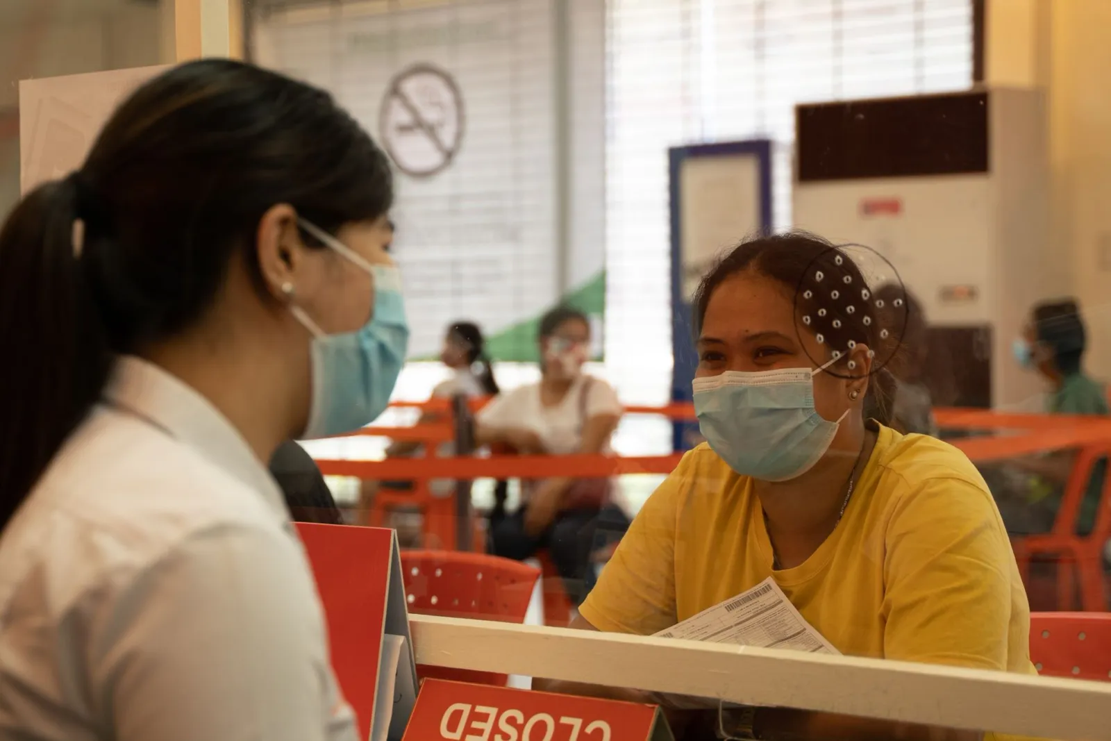 Meralco employee offering installment payments to a customer