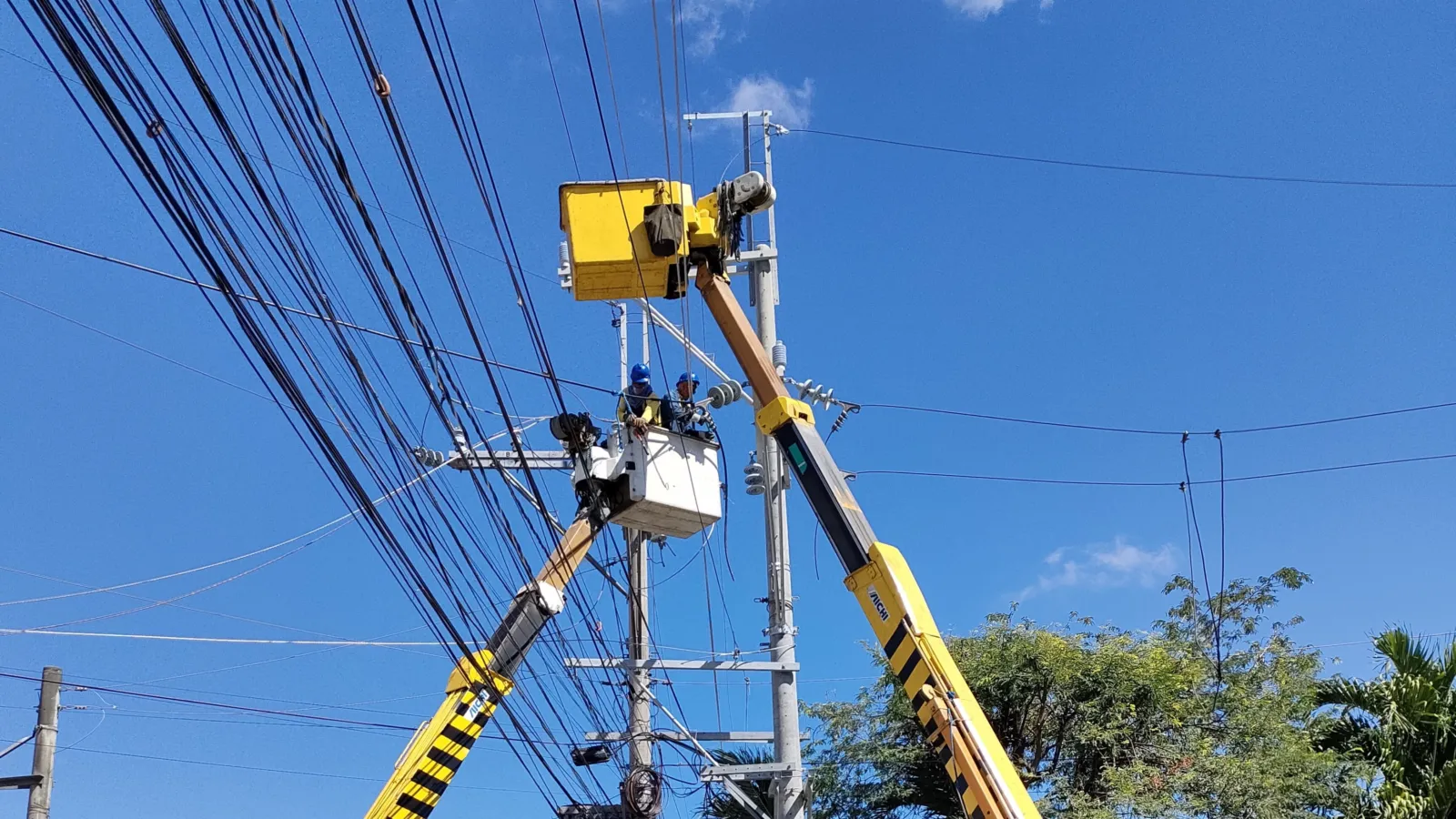 Meralco linemen working on power lines