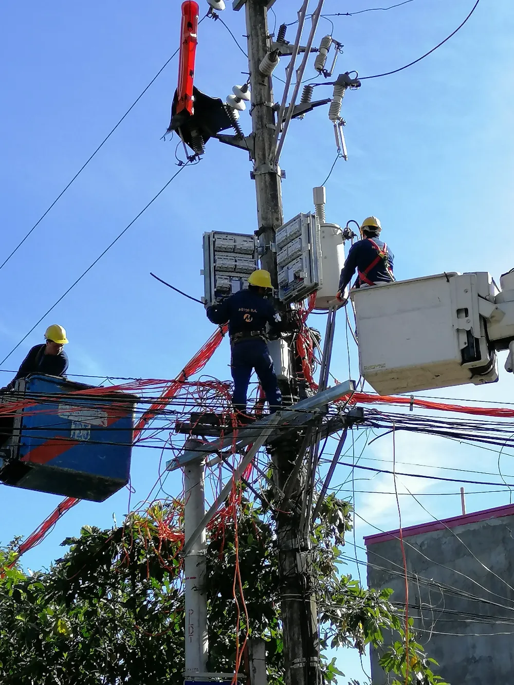 Meralco linemen working on power lines