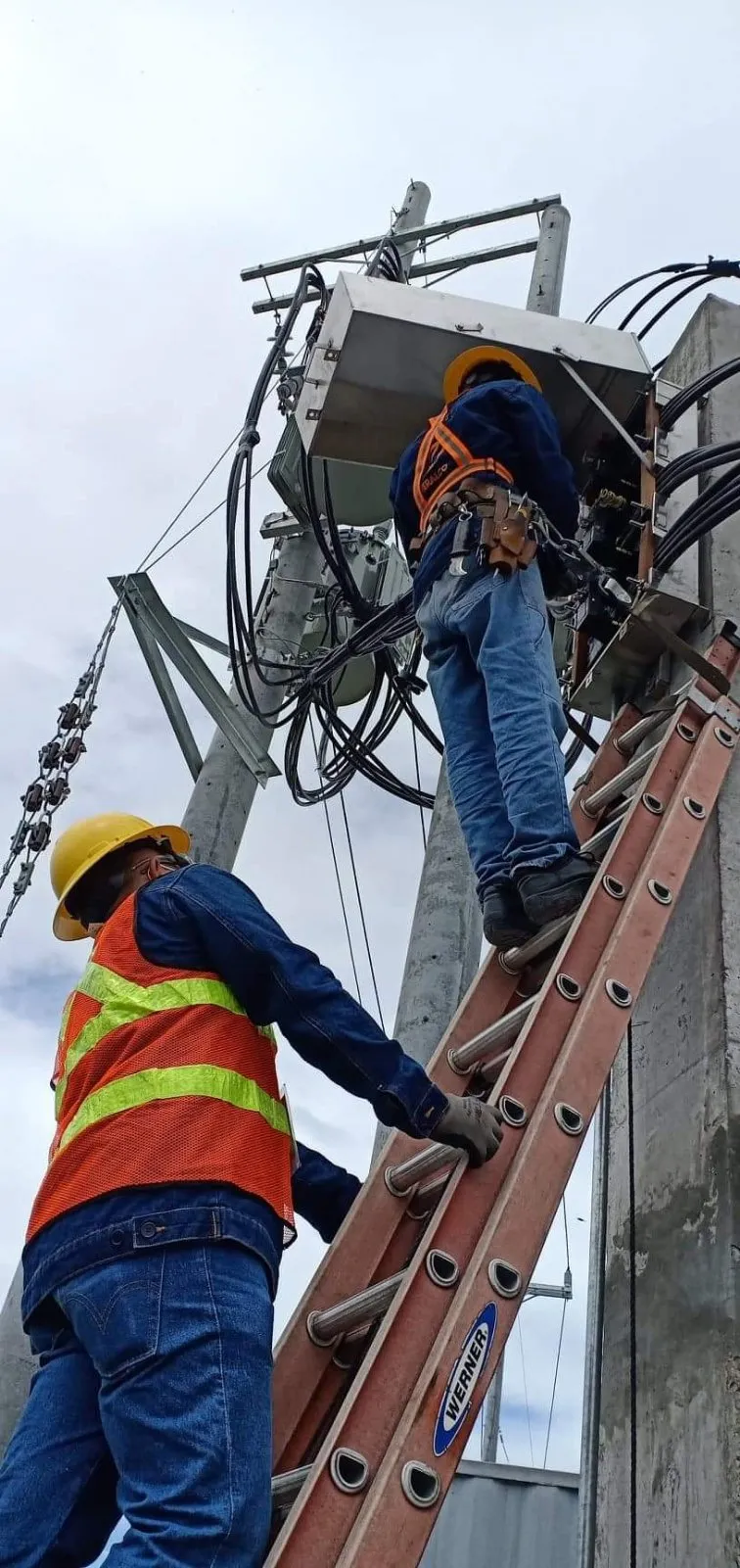 Meralco linemen working on power lines