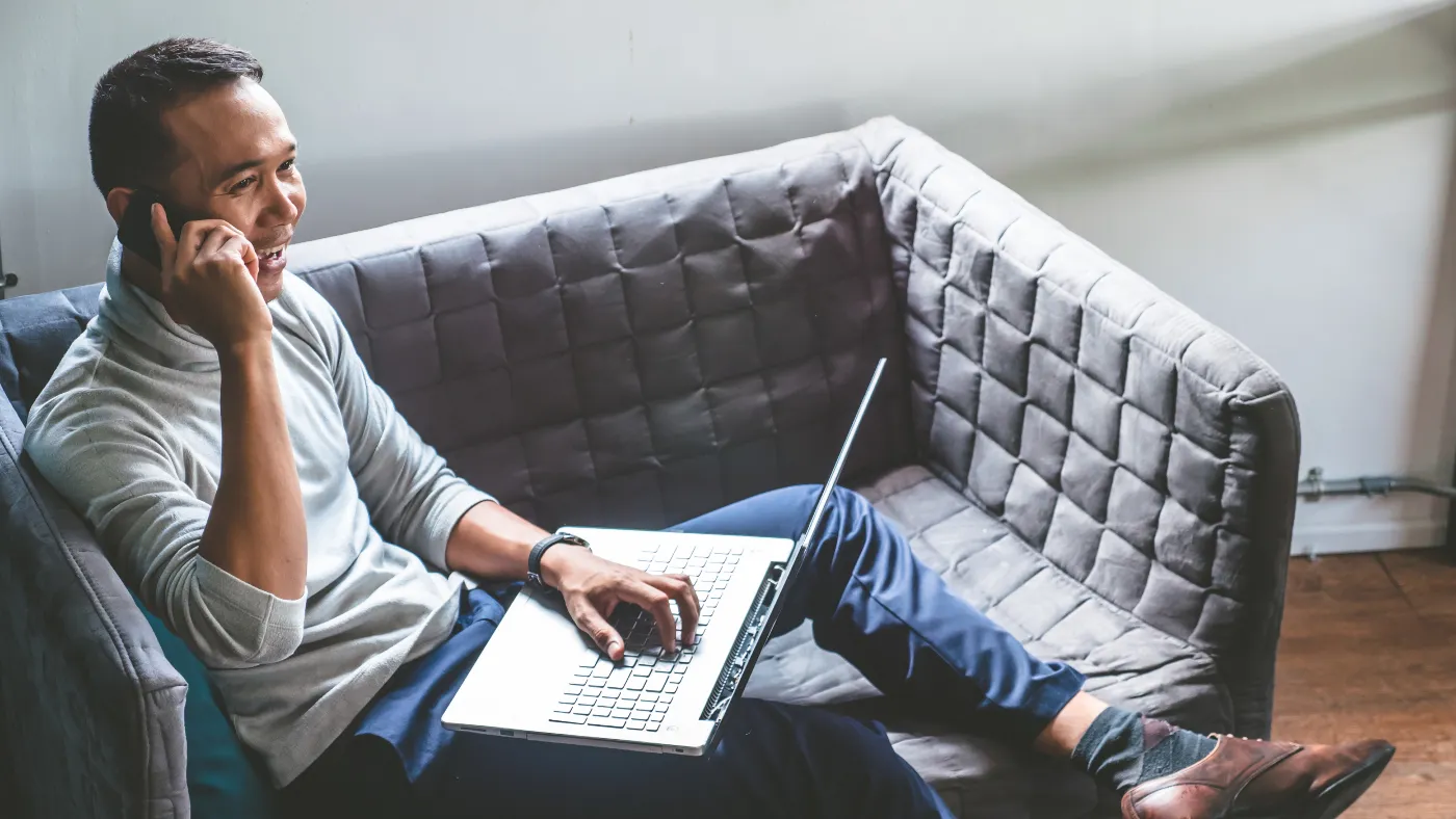 Man using his laptop and phone
