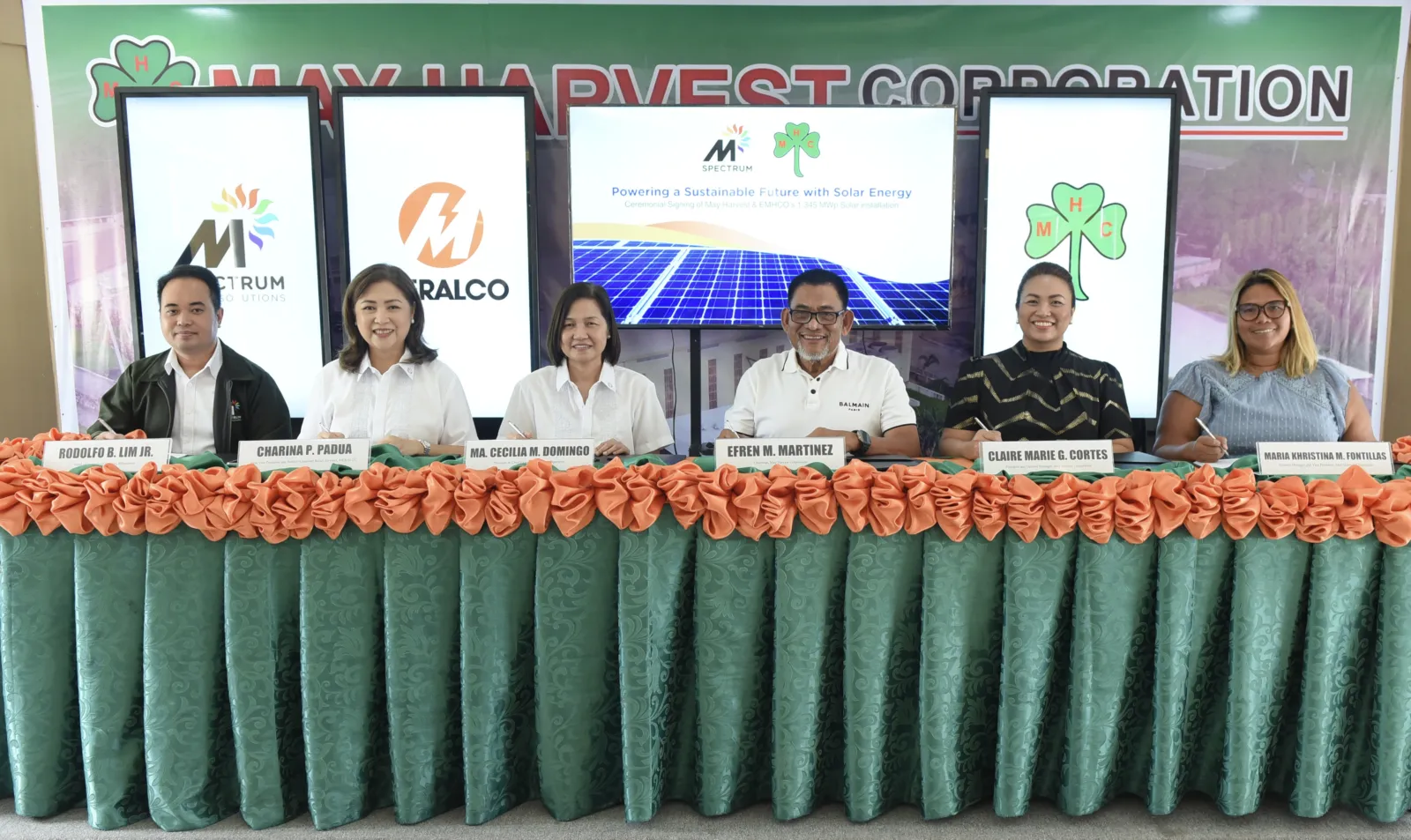 Six MSpectrum, Meralco, and May Harvest representatives pose at the ceremonial signing for May Harvest’s solar installation.