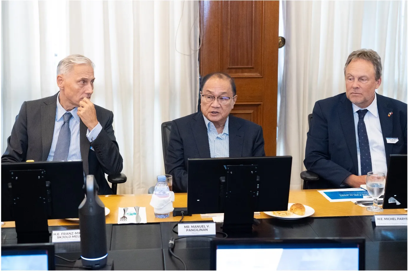Manuel V. Pangilinan speaks between Danish Ambassador Franz-Michael Skjold Mellbin and Belgian Ambassador Michel Parys during the renewable-energy roundtable.