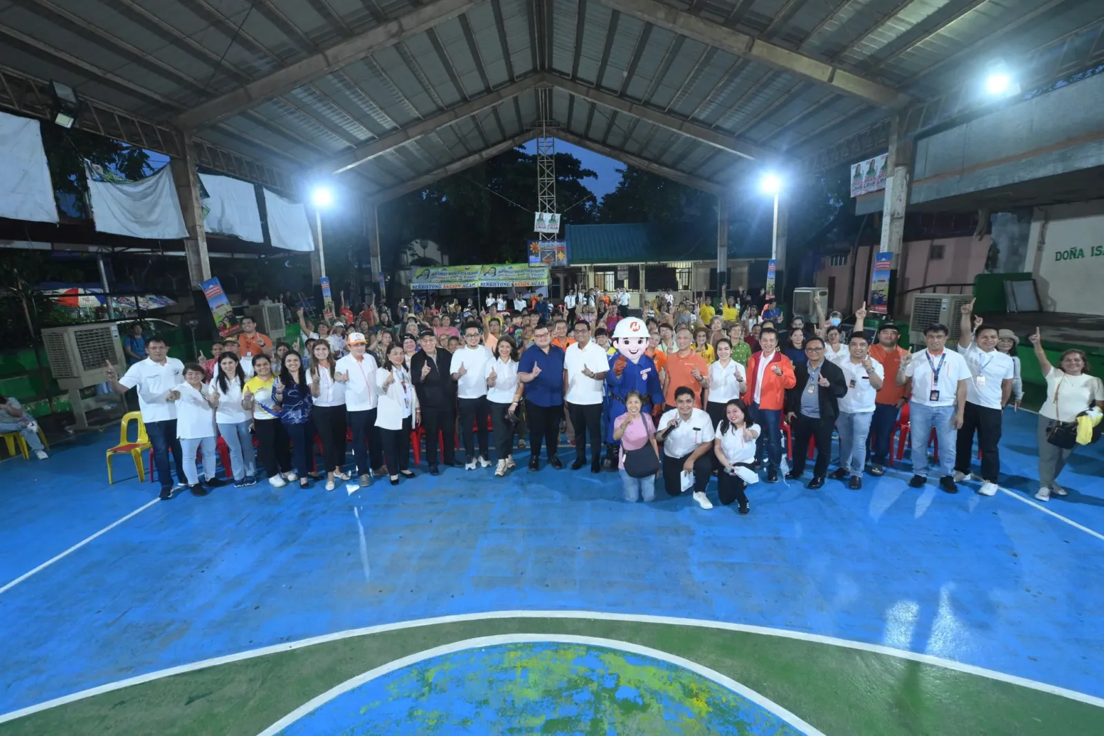 Household Electrification Program participants and community leaders gather after the Novaliches lighting ceremony.