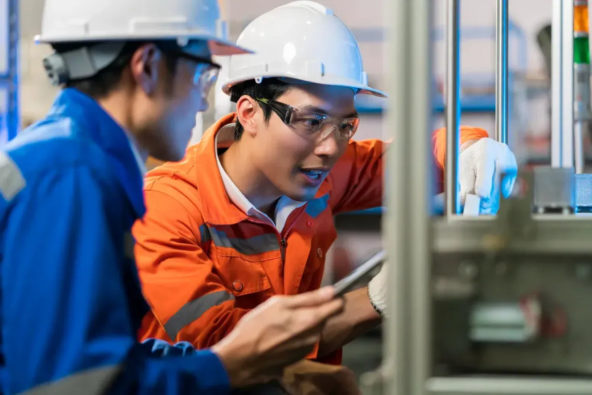 Energy professionals collaborate on technical work.