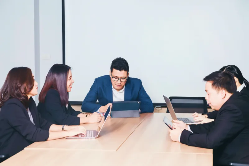A team reviews network investment plans in a meeting.