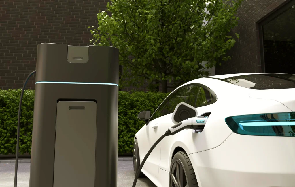 An electric vehicle charges outside a modern home.